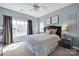 Bedroom with large window, soft colors, and decor at 14946 Shinner Dr, Huntersville, NC 28078