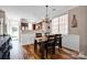 Dining room area featuring a dark wooden table and a chandelier at 14946 Shinner Dr, Huntersville, NC 28078