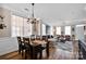 A dining room area seamlessly flowing into a comfortable living space at 14946 Shinner Dr, Huntersville, NC 28078