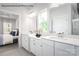 Clean bathroom featuring double sink vanity, white cabinets, and a window at 2016 Bramble Hedge Rd # 3277, Indian Trail, NC 28079