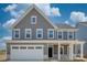 Charming two-story home with gray siding, white trim, a front porch, and an attached two-car garage at 2016 Bramble Hedge Rd # 3277, Indian Trail, NC 28079