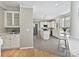 An elegant white kitchen featuring an island, modern appliances, and ample cabinet space at 20313 Queensdale Dr, Cornelius, NC 28031