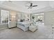 Spacious main bedroom with a tray ceiling, carpet, and large windows offers a peaceful retreat at 20313 Queensdale Dr, Cornelius, NC 28031