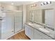 Stylish bathroom featuring double sinks, granite countertops, and a modern glass-enclosed shower at 217 Century Dr, Salisbury, NC 28147