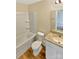 A full bathroom features a shower-tub combo, granite vanity and toilet at 217 Century Dr, Salisbury, NC 28147