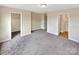 A primary bedroom features gray carpet and two closets at 217 Century Dr, Salisbury, NC 28147