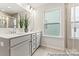 Bathroom featuring double sinks, granite countertops, a large mirror, and a glass shower enclosure at 2308 Bulwarks Ct # 8P, Albemarle, NC 28001