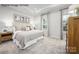 Serene main bedroom featuring plush carpet, neutral tones, and large windows for natural light at 2516 Ellen Ave # 1001B, Charlotte, NC 28208