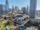 Apartment building with an aerial view of the vibrant city skyline and surrounding neighborhood at 300 W 5Th St # 344, Charlotte, NC 28202