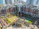 Stunning aerial view of the community courtyard with a fountain, lawn, and other recreation amenities at 300 W 5Th St # 344, Charlotte, NC 28202