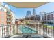 Balcony view overlooking a community pool and beautiful cityscape at 300 W 5Th St # 344, Charlotte, NC 28202