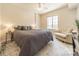 Bedroom features a large bed and sitting area with ample natural light at 300 W 5Th St # 344, Charlotte, NC 28202