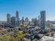 A panoramic aerial view showcasing the city's impressive skyline on a clear day at 300 W 5Th St # 344, Charlotte, NC 28202