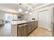 Spacious kitchen featuring a stainless steel dishwasher and breakfast bar that opens up to a living space at 300 W 5Th St # 344, Charlotte, NC 28202