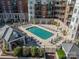 Aerial view of a refreshing pool with ample lounge chairs and well-maintained grounds for relaxation at 300 W 5Th St # 344, Charlotte, NC 28202