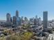 Beautiful skyline views in the distance behind lush greenery and rooftop views, highlighting the city location at 300 W 5Th St # 344, Charlotte, NC 28202