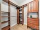 Walk-in closet with custom wood shelving and ample storage space at 300 W 5Th St # 344, Charlotte, NC 28202