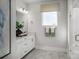 Bright bathroom featuring a sleek vanity, modern lighting, and a walk-in shower with white subway tile at 3063 Finchborough Ct # 216, Charlotte, NC 28269