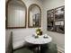 Bright breakfast nook featuring a marble table, modern mirrors, art, and stylish decor at 3063 Finchborough Ct # 216, Charlotte, NC 28269