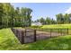Fully fenced dog park with ample space for pets to play and socialize in a safe environment at 3063 Finchborough Ct # 216, Charlotte, NC 28269