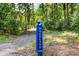 Follow the trail through lush greenery to find a peaceful woodland retreat and bridge at 3063 Finchborough Ct # 216, Charlotte, NC 28269