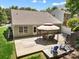 Aerial view of backyard with a patio, deck, furniture, and lush landscaping at 4323 Wiregrass Rd, Indian Land, SC 29707