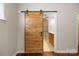 Bathroom featuring a sliding barn door and well-lit vanity area at 4323 Wiregrass Rd, Indian Land, SC 29707