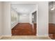 Spacious dining room with hardwood floors, large windows, and modern chandelier at 4323 Wiregrass Rd, Indian Land, SC 29707