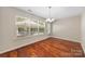 Sun-drenched dining area with wood floors and outdoor views at 4323 Wiregrass Rd, Indian Land, SC 29707