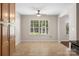 Bright dining area featuring a large window, tile flooring, and view of the kitchen at 4323 Wiregrass Rd, Indian Land, SC 29707