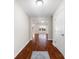 Inviting hallway with gleaming hardwood floors and views into the spacious living areas at 4323 Wiregrass Rd, Indian Land, SC 29707