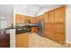 Well-lit kitchen featuring stainless steel appliances, granite countertops, and ample cabinetry at 4323 Wiregrass Rd, Indian Land, SC 29707