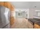 Open kitchen flows into the breakfast nook with stainless steel appliances and wood cabinets at 4323 Wiregrass Rd, Indian Land, SC 29707