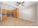 Bright kitchen with wood cabinets, stainless steel appliances, and tile flooring at 4323 Wiregrass Rd, Indian Land, SC 29707