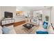 Bright living room with modern furniture and a view of the dining area beyond at 4323 Wiregrass Rd, Indian Land, SC 29707