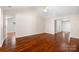 Bright and airy living room with vaulted ceilings and gleaming hardwood floors at 4323 Wiregrass Rd, Indian Land, SC 29707