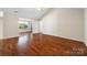 Open living room showcasing hardwood floors and adjoining dining area at 4323 Wiregrass Rd, Indian Land, SC 29707