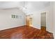 Bright main bedroom with vaulted ceiling, wood floors, and ensuite bathroom at 4323 Wiregrass Rd, Indian Land, SC 29707