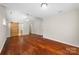 Bright main bedroom with vaulted ceiling, wood floors, and ensuite bathroom at 4323 Wiregrass Rd, Indian Land, SC 29707