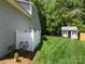 Spacious backyard with shed and mature landscaping, featuring a white fence at 4323 Wiregrass Rd, Indian Land, SC 29707