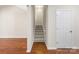 View of staircase with wooden floors and white walls at 4323 Wiregrass Rd, Indian Land, SC 29707