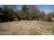 Large backyard with mature trees and open space at 4626 Annerly Ct, Charlotte, NC 28226