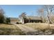 Exterior view of brick home with detached garage and long driveway at 4626 Annerly Ct, Charlotte, NC 28226