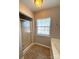 Bathroom with shower, window, and neutral paint and tile flooring at 5011 Abercromby St, Charlotte, NC 28213