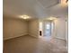 Bedroom with carpet and a view to the bathroom and bedroom with carpet at 5011 Abercromby St, Charlotte, NC 28213