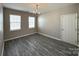 Cozy dining area with stylish light fixture and plenty of natural light at 5011 Abercromby St, Charlotte, NC 28213