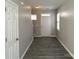 Inviting entryway featuring stylish gray flooring and a bright, welcoming atmosphere at 5011 Abercromby St, Charlotte, NC 28213