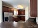 Well-equipped kitchen featuring stainless steel appliances and sleek dark cabinetry at 5011 Abercromby St, Charlotte, NC 28213