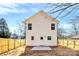 Exterior view of the home's backyard featuring a new fence and straw-covered yard at 515 Harrel St, Salisbury, NC 28144