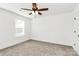 Bedroom with neutral carpet, a ceiling fan, and a window providing natural light at 515 Harrel St, Salisbury, NC 28144